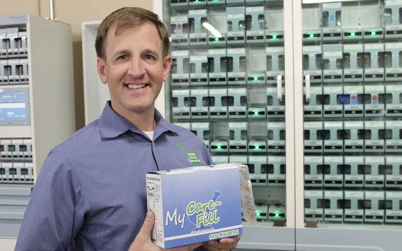 Bretton shows his branded PASS Pack box next to the Parata PASS